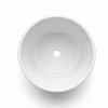 Vue de dessus de l'intérieur d'un pot de fleur blanc vierge pour succulentes, montrant le trou de drainage central. Pot en céramique pour personnalisation par sublimation.